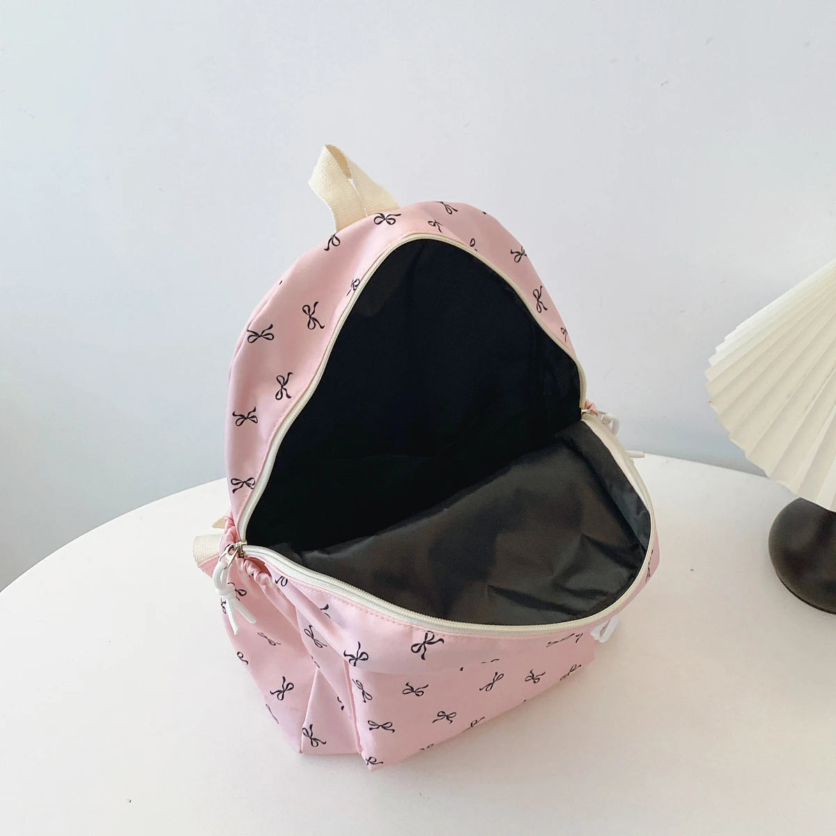 Women's Bow Print Backpack with Front Zipper Pocket for School Outfits