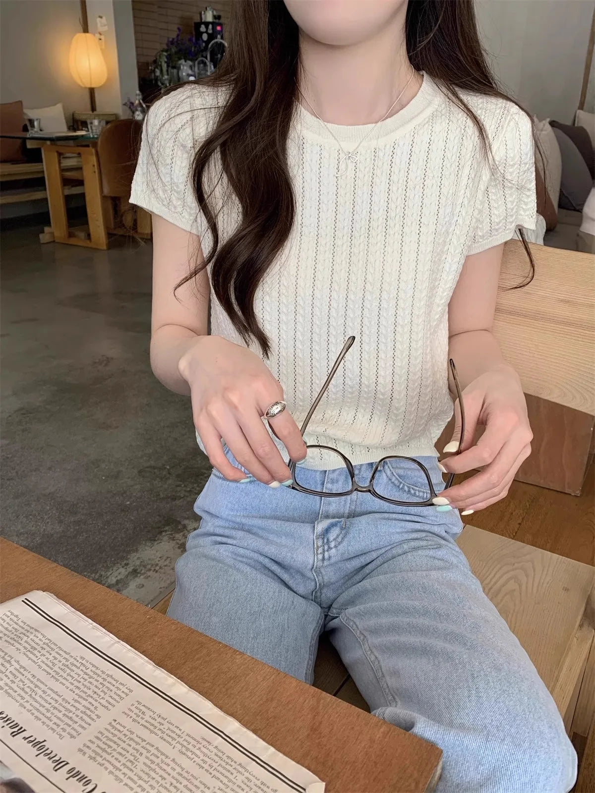 A hollowed-out round-neck ice silk knitted T-shirt for women in summer, a loose short-sleeved and slimming top, is thin