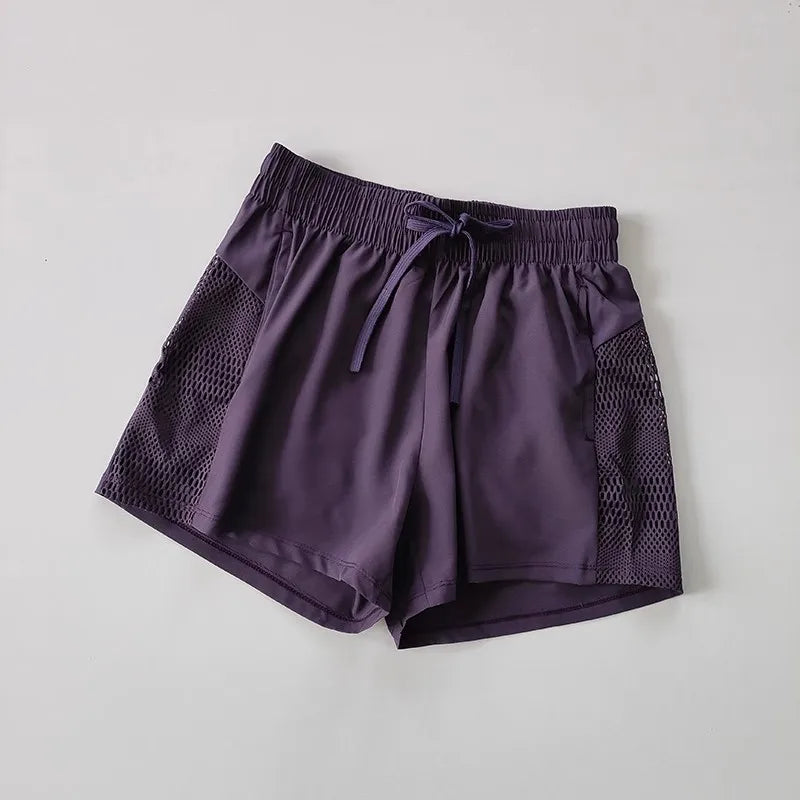 Women's Loose Fit Sports Shorts with Mesh Panels and Side Pockets