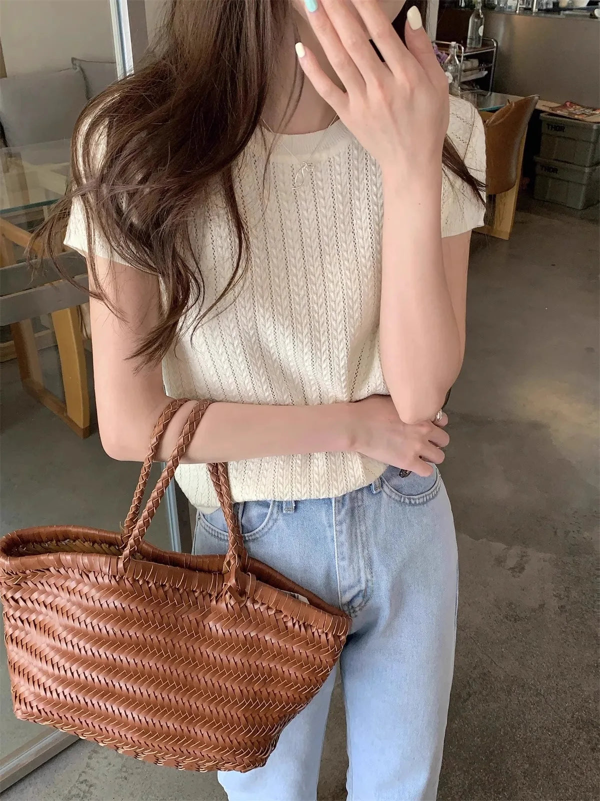 A hollowed-out round-neck ice silk knitted T-shirt for women in summer, a loose short-sleeved and slimming top, is thin