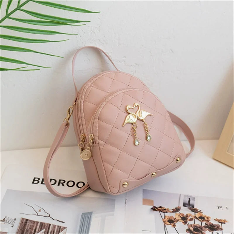 Women's Quilted Mini Backpack with Bow Detail and Top Carry Handle