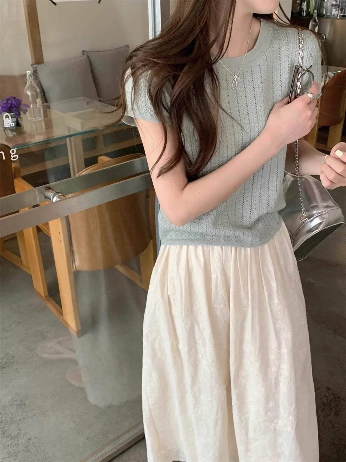 A hollowed-out round-neck ice silk knitted T-shirt for women in summer, a loose short-sleeved and slimming top, is thin