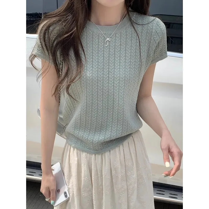 A hollowed-out round-neck ice silk knitted T-shirt for women in summer, a loose short-sleeved and slimming top, is thin