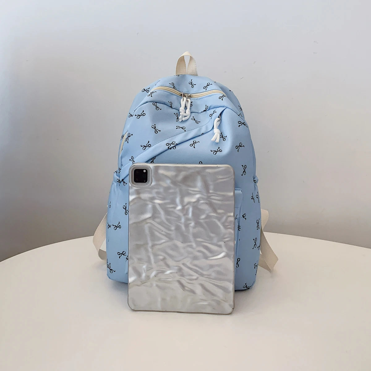 Women's Bow Print Backpack with Front Zipper Pocket for School Outfits