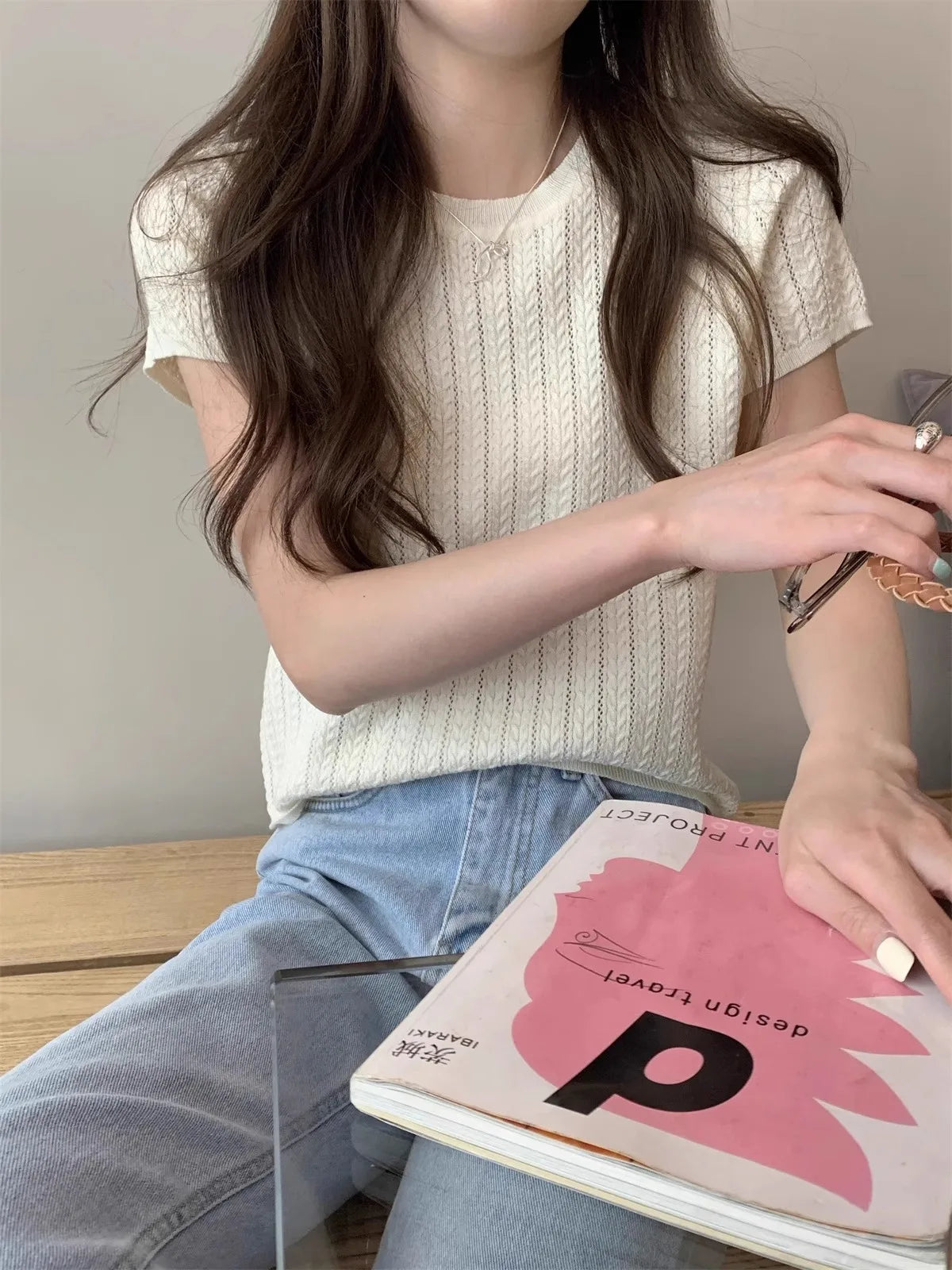 A hollowed-out round-neck ice silk knitted T-shirt for women in summer, a loose short-sleeved and slimming top, is thin