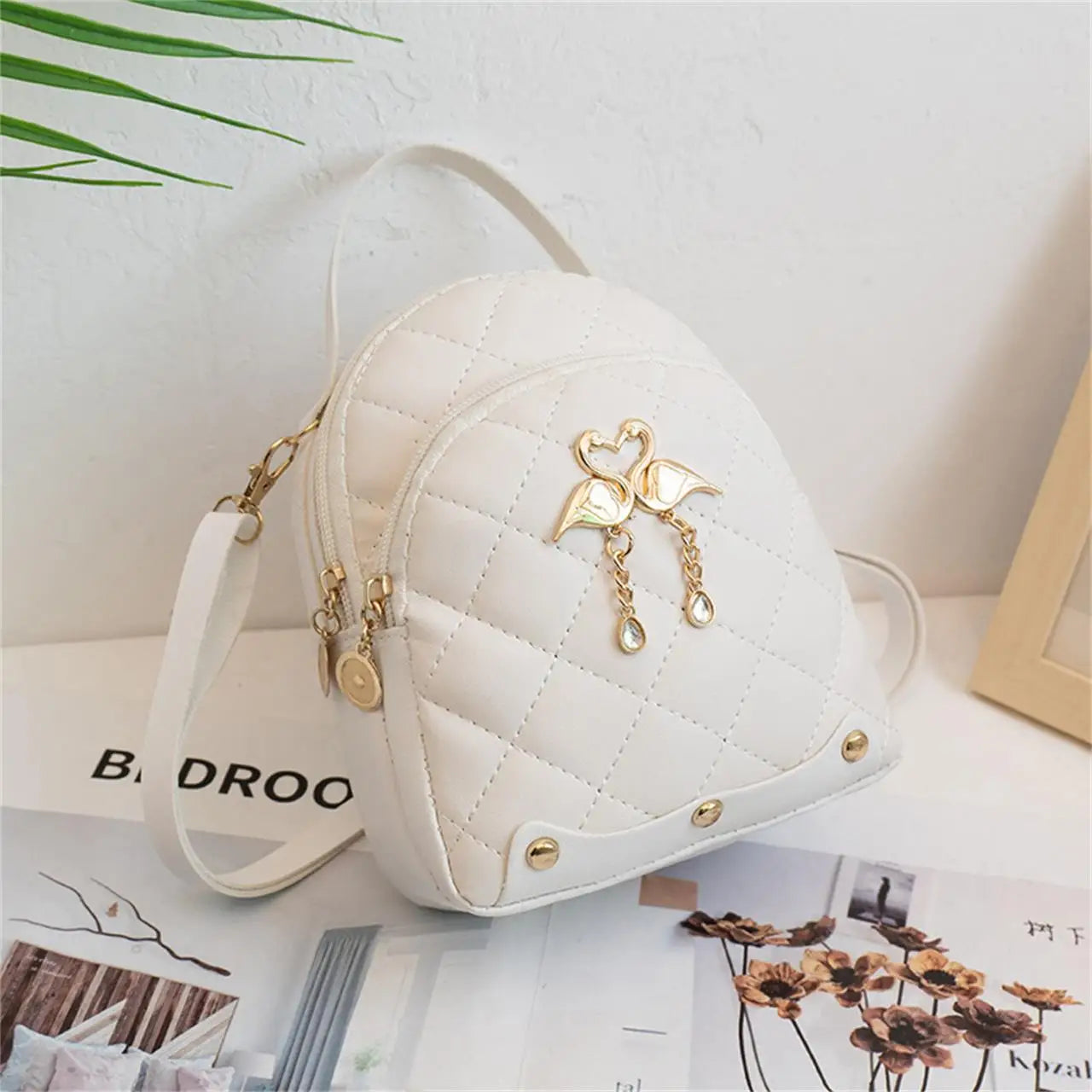 Women's Quilted Mini Backpack with Bow Detail and Top Carry Handle