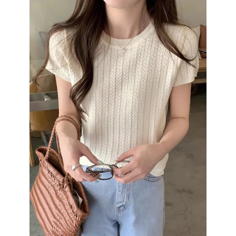 A hollowed-out round-neck ice silk knitted T-shirt for women in summer, a loose short-sleeved and slimming top, is thin