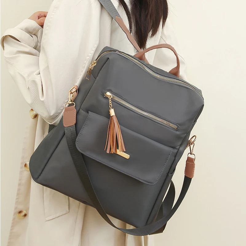 Tassel Detail Backpack with Front Pockets and Adjustable Shoulder Strap Design