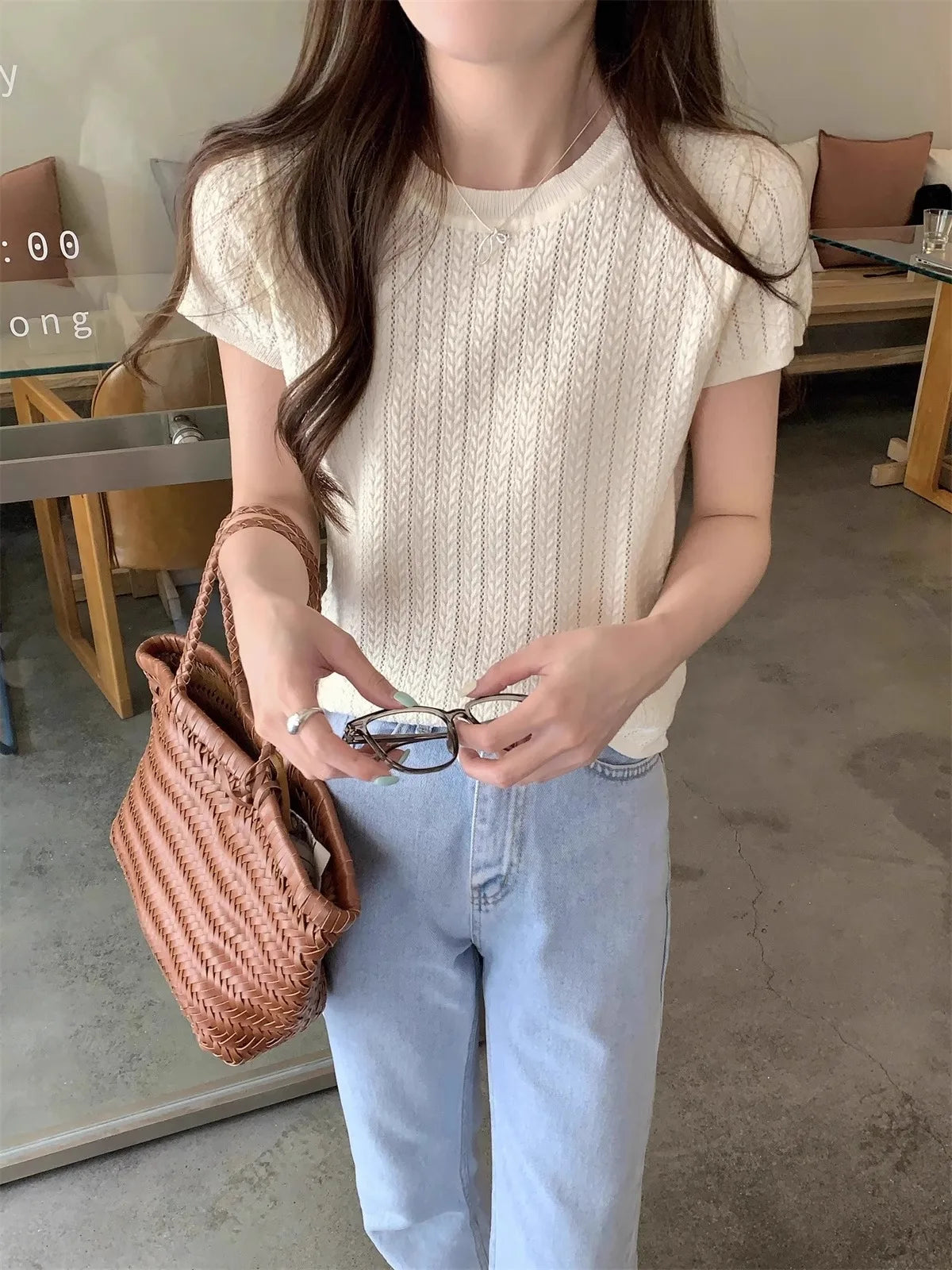 A hollowed-out round-neck ice silk knitted T-shirt for women in summer, a loose short-sleeved and slimming top, is thin