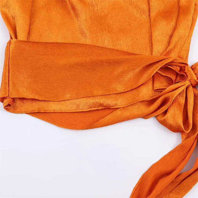 Women's Sleeveless Blouse with a Draped Neckline and Long Ribbon Ties
