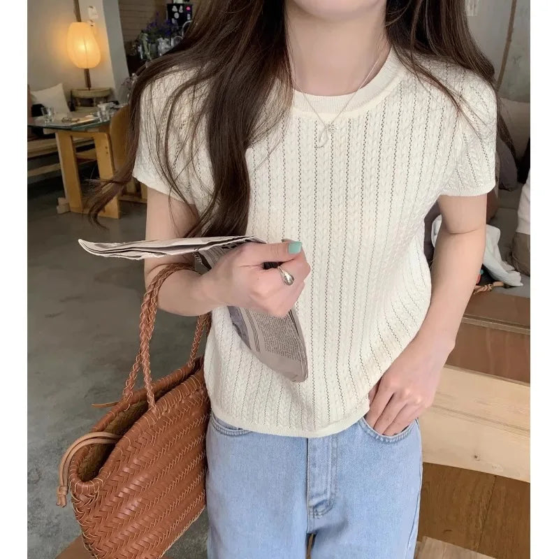 A hollowed-out round-neck ice silk knitted T-shirt for women in summer, a loose short-sleeved and slimming top, is thin