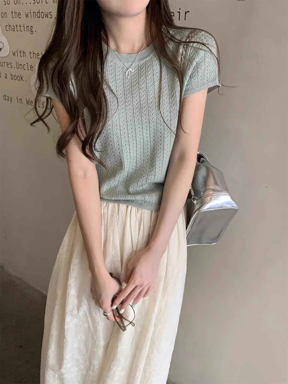 A hollowed-out round-neck ice silk knitted T-shirt for women in summer, a loose short-sleeved and slimming top, is thin