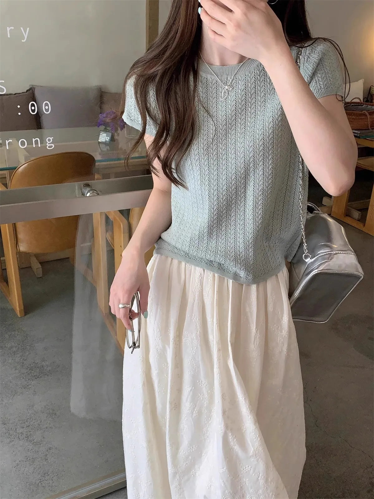 A hollowed-out round-neck ice silk knitted T-shirt for women in summer, a loose short-sleeved and slimming top, is thin