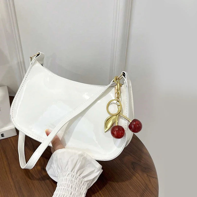 Solid Shoulder Handbag with Decorative Cherry Pendant Detail