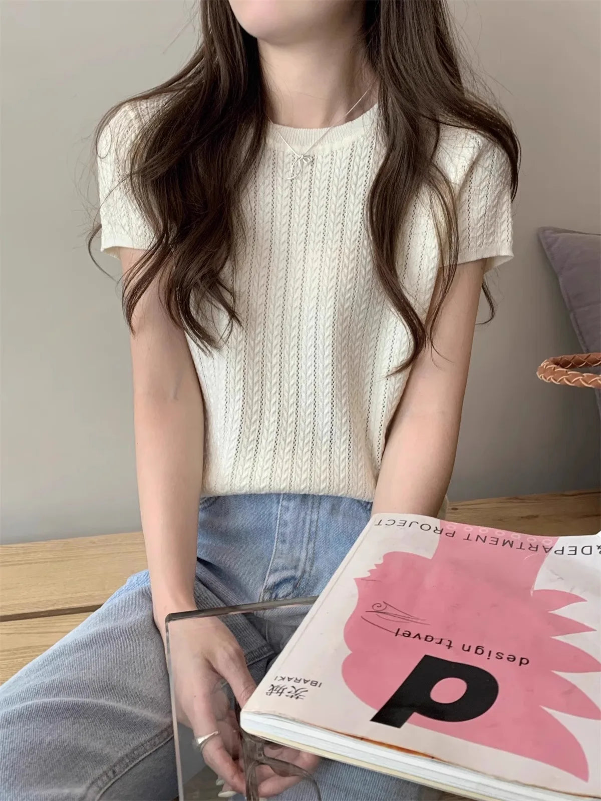 A hollowed-out round-neck ice silk knitted T-shirt for women in summer, a loose short-sleeved and slimming top, is thin