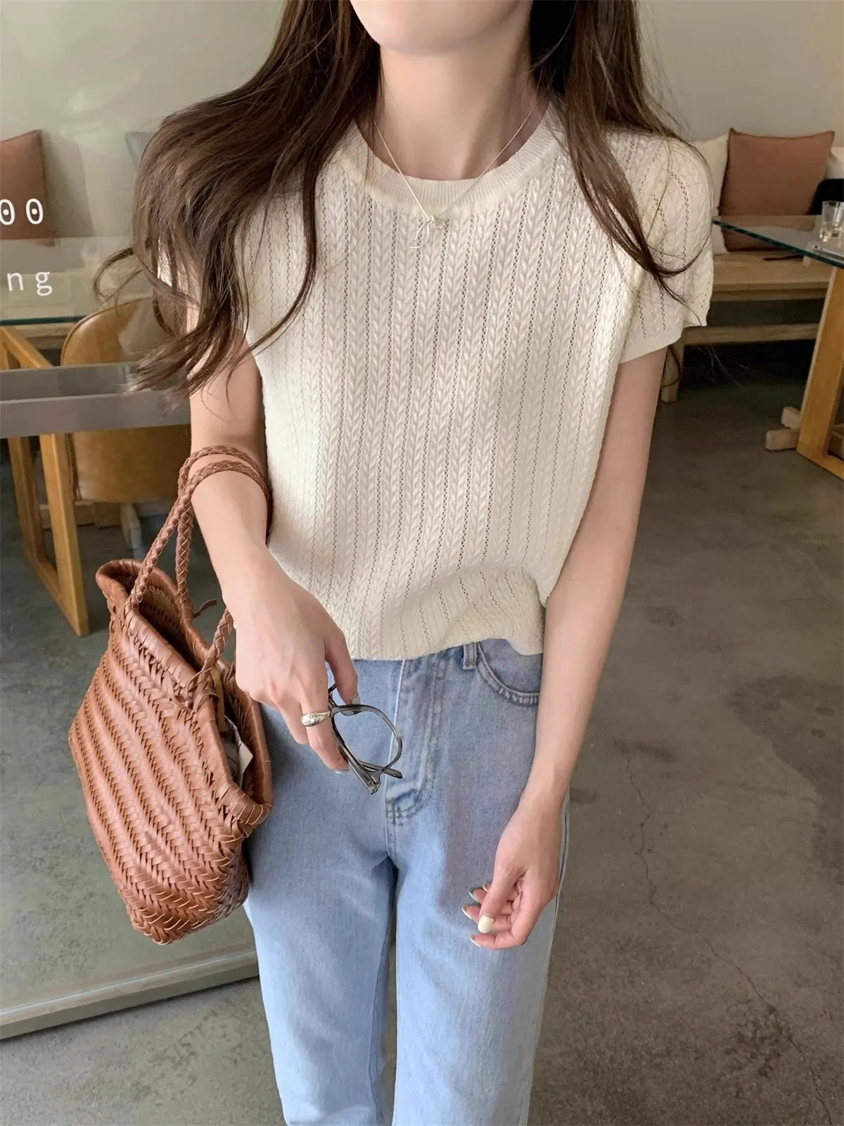A hollowed-out round-neck ice silk knitted T-shirt for women in summer, a loose short-sleeved and slimming top, is thin