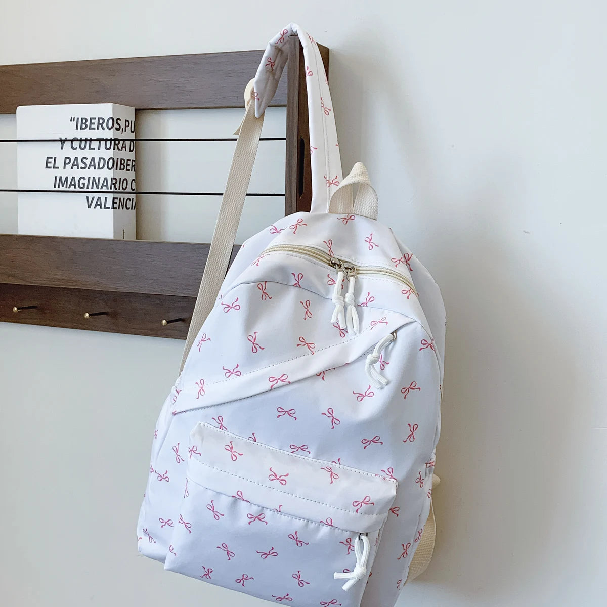 Women's Bow Print Backpack with Front Zipper Pocket for School Outfits