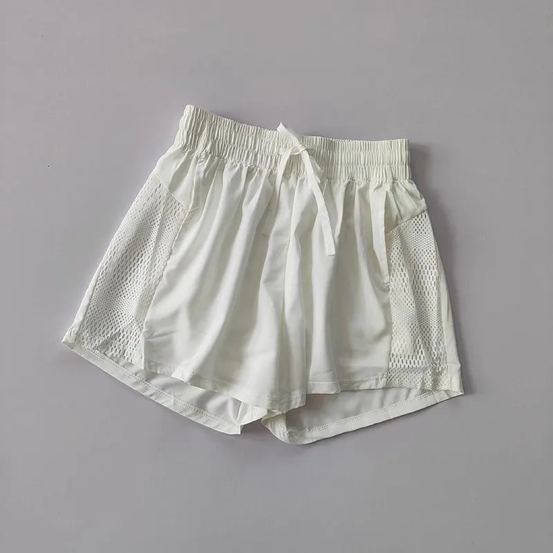 Women's Loose Fit Sports Shorts with Mesh Panels and Side Pockets