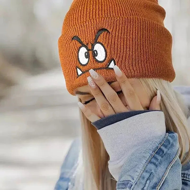 Orange Knit Beanie with Embroidered Cartoon Expression Detail
