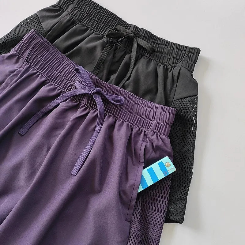 Women's Loose Fit Sports Shorts with Mesh Panels and Side Pockets