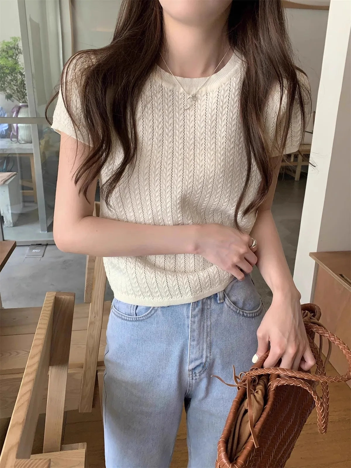 A hollowed-out round-neck ice silk knitted T-shirt for women in summer, a loose short-sleeved and slimming top, is thin