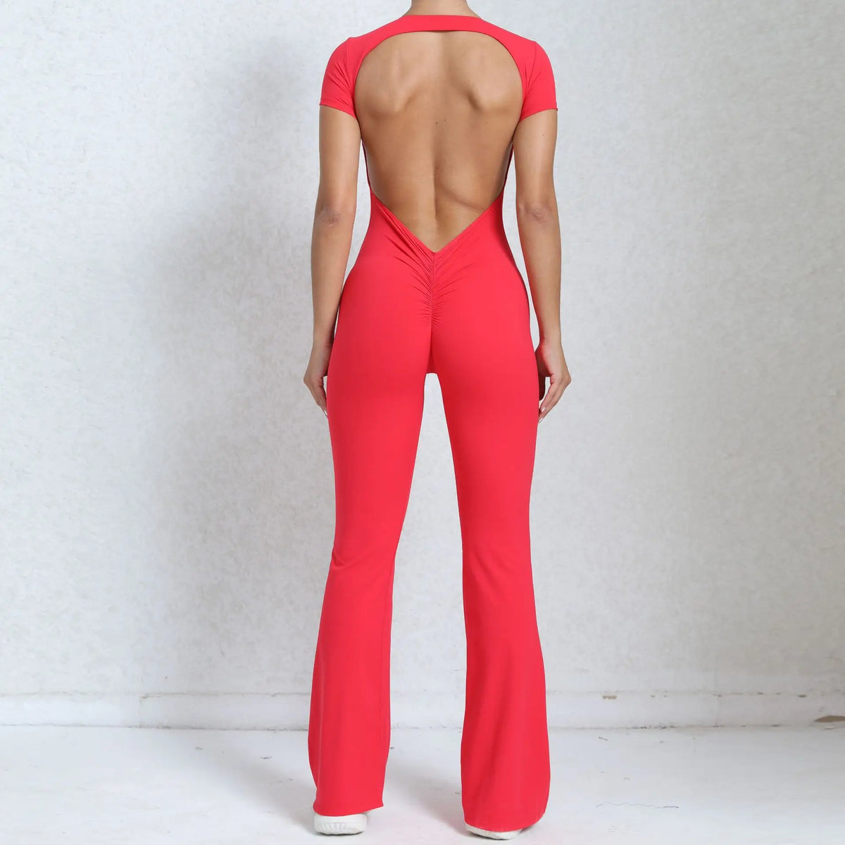 Women's Long Sleeve Nylon Blend Workout Jumpsuit with Open Back
