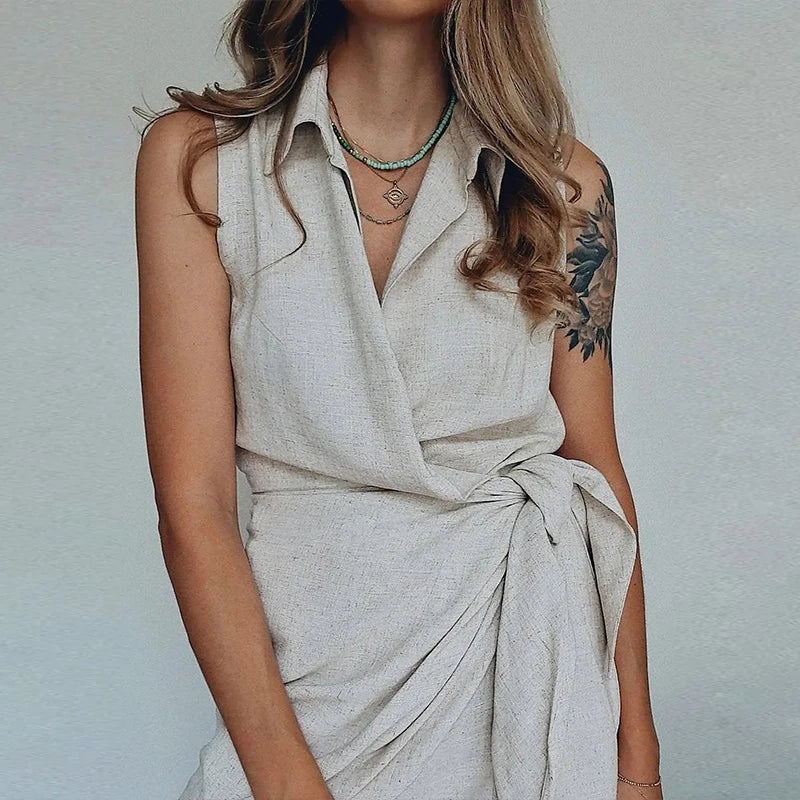 Women's Sleeveless Collared Mini Dress with Waist Tie and Asymmetrical Wrap Hem