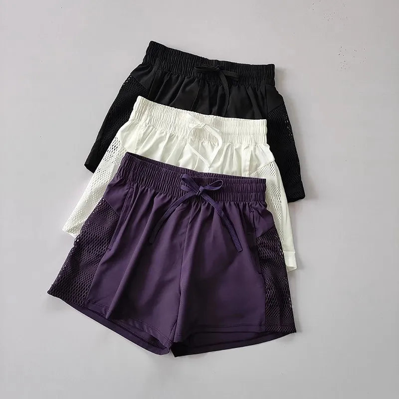 Women's Loose Fit Sports Shorts with Mesh Panels and Side Pockets