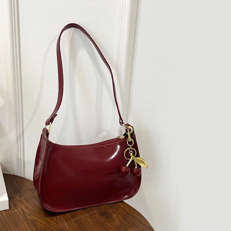 Solid Shoulder Handbag with Decorative Cherry Pendant Detail