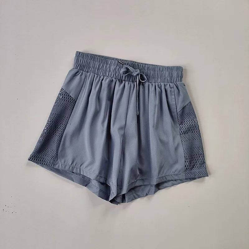 Women's Loose Fit Sports Shorts with Mesh Panels and Side Pockets