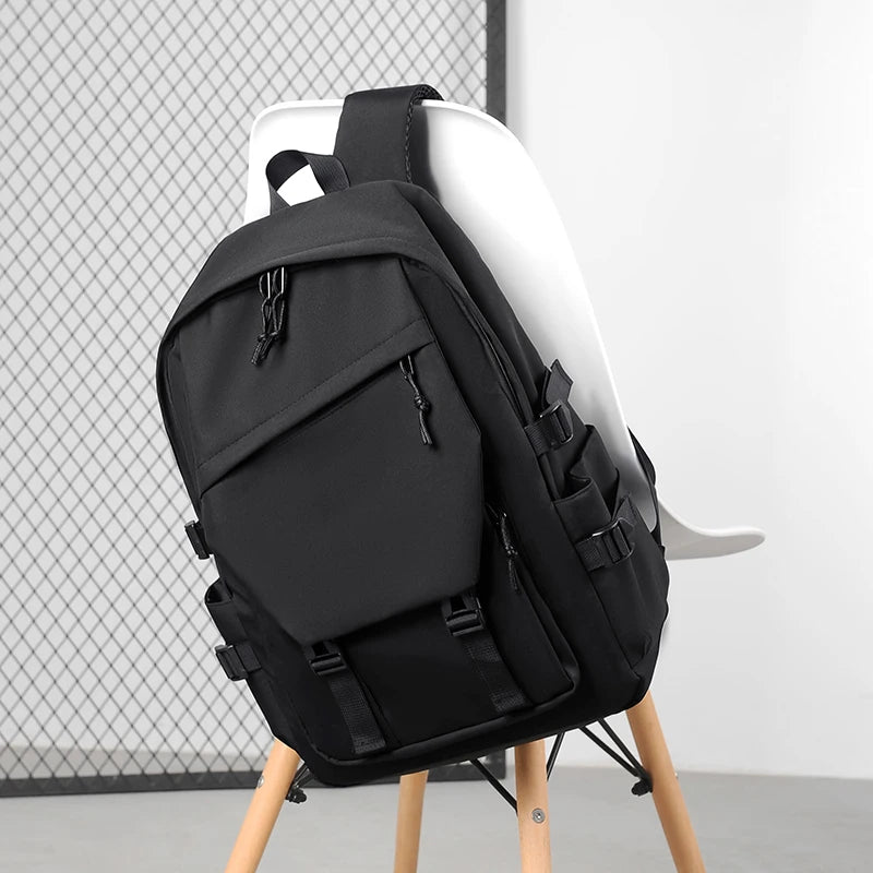Plain Laptop Backpack with Multiple Pockets and Side Buckle Strap Details