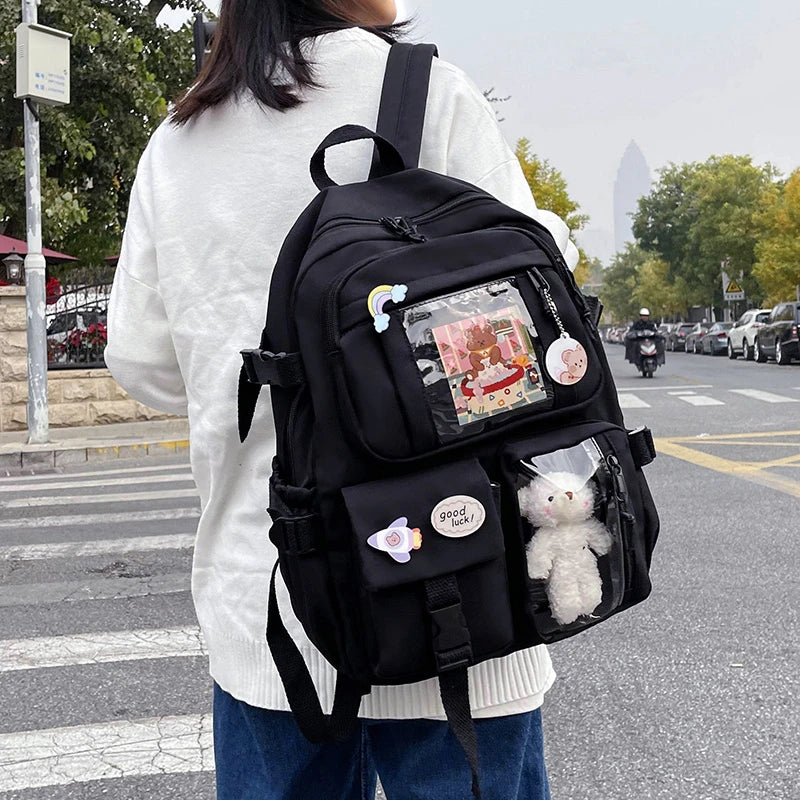 Multi-Pocket Student Backpack with Transparent Display Panels and Side Strap Details