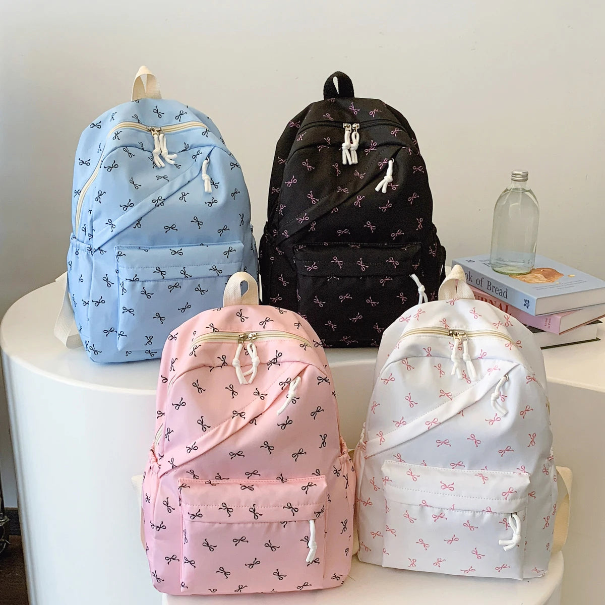 Women's Bow Print Backpack with Front Zipper Pocket for School Outfits