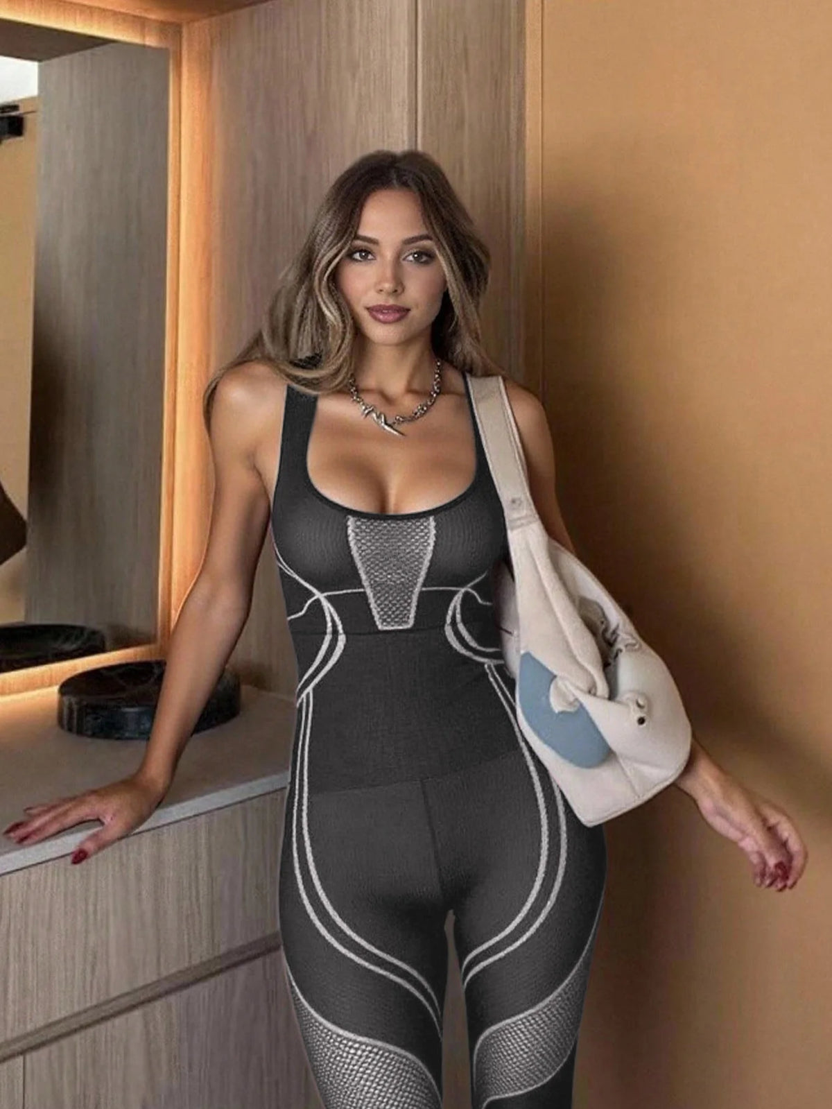Women's Mesh Inset Nylon Blend Workout Jumpsuit with Contour Seams and Back Cutout